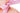 Close-up of a pink ribbon tied on Sheepskin Boots and fine suede from kiwi sheepskins on a white background #color_pink
