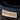 Close-up of black Sheepskin Boots with the brand Kiwi Sheepskins,  showing the fluffy interior made of short wool sheepskin fur #color_black