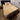 A Wool mattress topper placed on a bed, shaped as a rectangle covering the entire bed, known as the best mattress topper for back pain adopted by hospitals and institutions globally from kiwi sheepskins