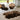 Chocolate color Sheepskin rugs on a light-colored floor with chairs and cushions in the background