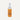 A white spray bottle labeled 'WOOLSKIN' with text describing the product as a protector and water repellent for sheepskin products.
