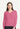 A person wearing a pink, long-sleeved, V-neck sweater with detailed design, suitable for autumn or spring wear.